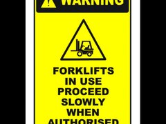 Sign warning forklifts in use proceed slowly when authorised