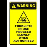 Sign warning forklifts in use proceed slowly when authorised